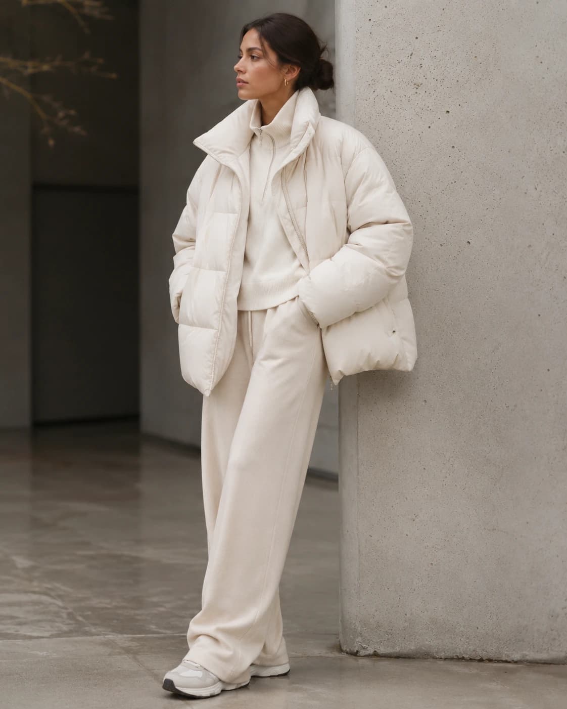 Model in an ivory cashmere wrap coat