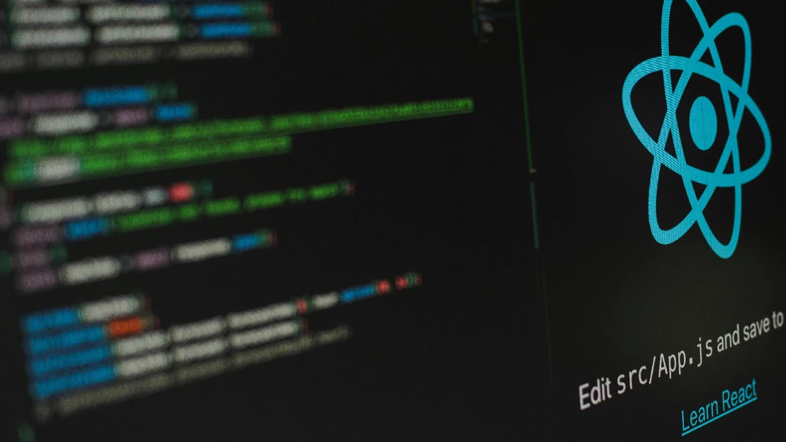 Computer screens showing a blue React logo beside blurred source code.